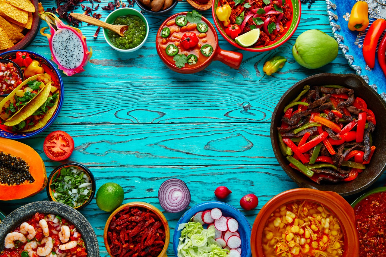 A colorful spread of Mexican food and fresh ingredients